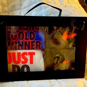 Nike 4 piece gift set , 2 onesies 1 hat 1 pair pants . New in Box 0/6months